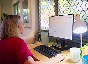 Lady sitting in front of her computer